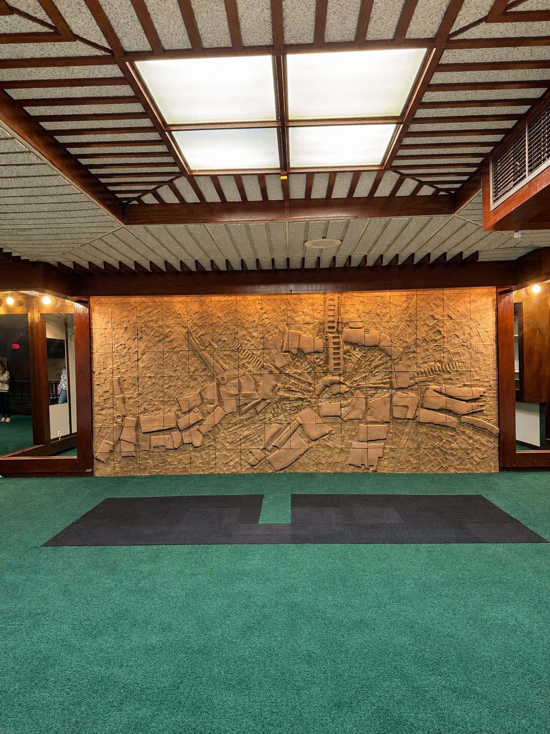 Upper-level artwork and brick